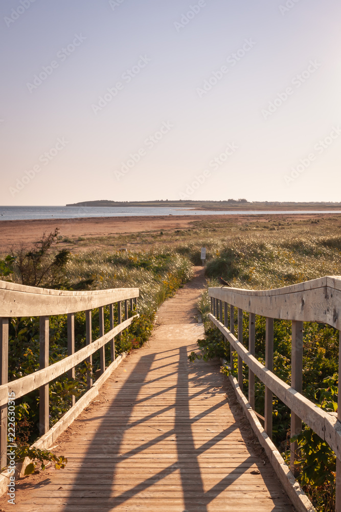 Sandy boardwalk to a Prince Edward island beach at sun rise