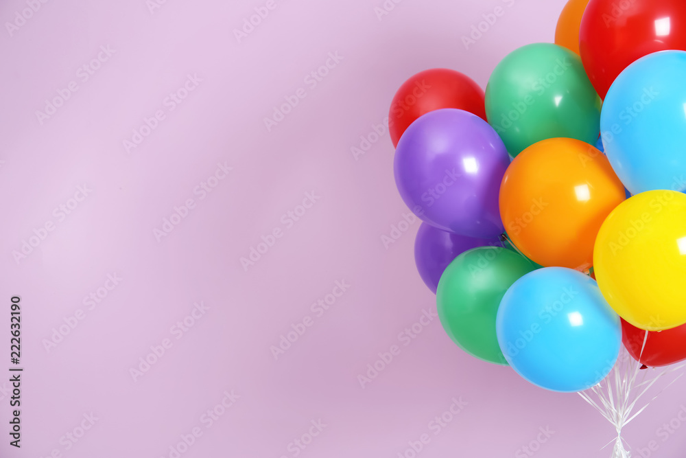 Bunch of bright balloons and space for text against color background Bunch of bright balloons and space for text against color background