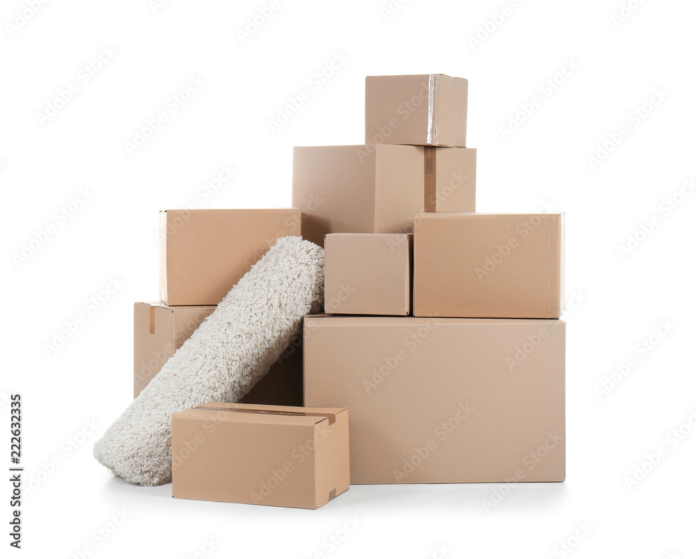 Cardboard boxes and rug on white background. Moving day Cardboard boxes and rug on white background. Moving day