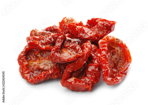Tasty sun dried tomatoes on white background