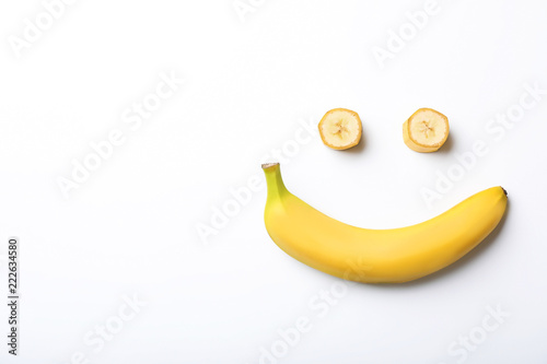 Funny flat lay composition with bananas on white background