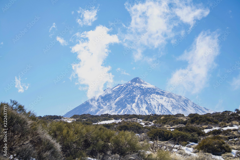 Fototapeta premium View of El Teide from the north side. Snowy and covered in clouds. Tenerife, Canary Islands