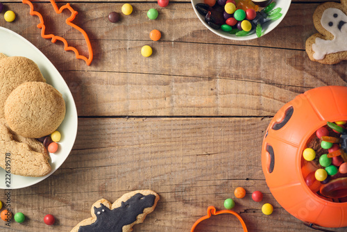 Halloween candies on wood table - holiday background