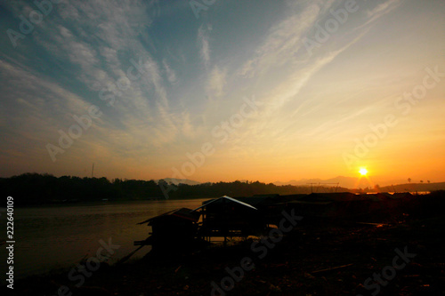 Houseboat is Country house with sunrise at the village at Snagklaburi, Thailand