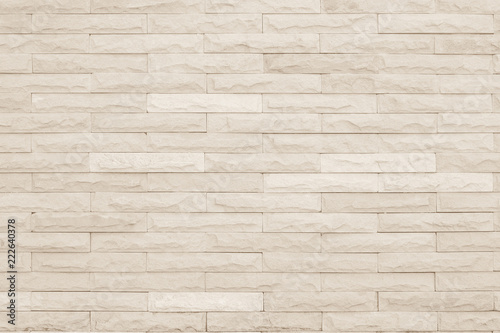 Seamless Cream pattern of decorative brick sandstone wall surface with concrete of modern style design decorative uneven have cracked realmasonry wall of multicolored stones or blocks with cement.