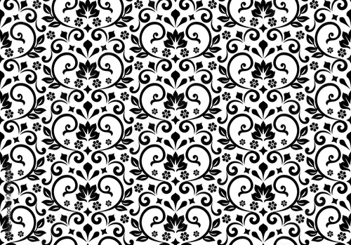 Wallpaper in the style of Baroque. Seamless vector background. White and black floral ornament. Graphic pattern for fabric, wallpaper, packaging. Ornate Damask flower ornament