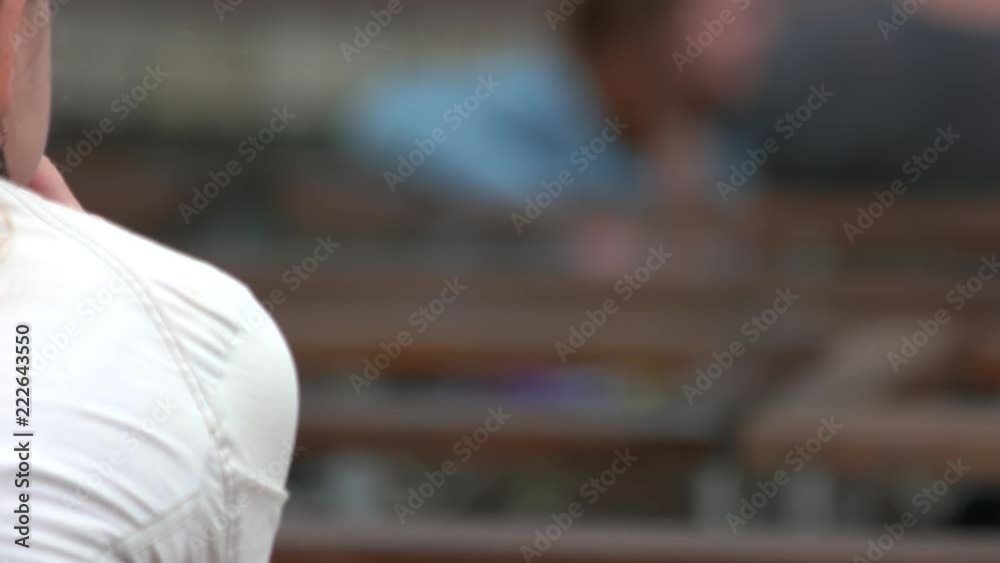 Woman holding burning cigarette in hand. Back view. Close up. Woman holding burning cigarette in hand. Back view. Close up.