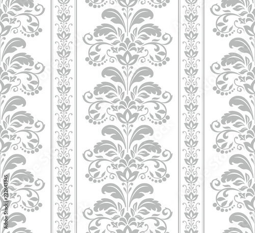 Wallpaper in the style of Baroque. Seamless vector background. White and grey floral ornament. Graphic pattern for fabric, wallpaper, packaging. Ornate Damask flower ornament.