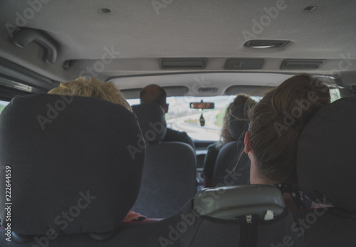 Tourists go to travel by minibus.