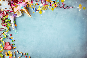 Colorful unicorn carnival border over a blue background