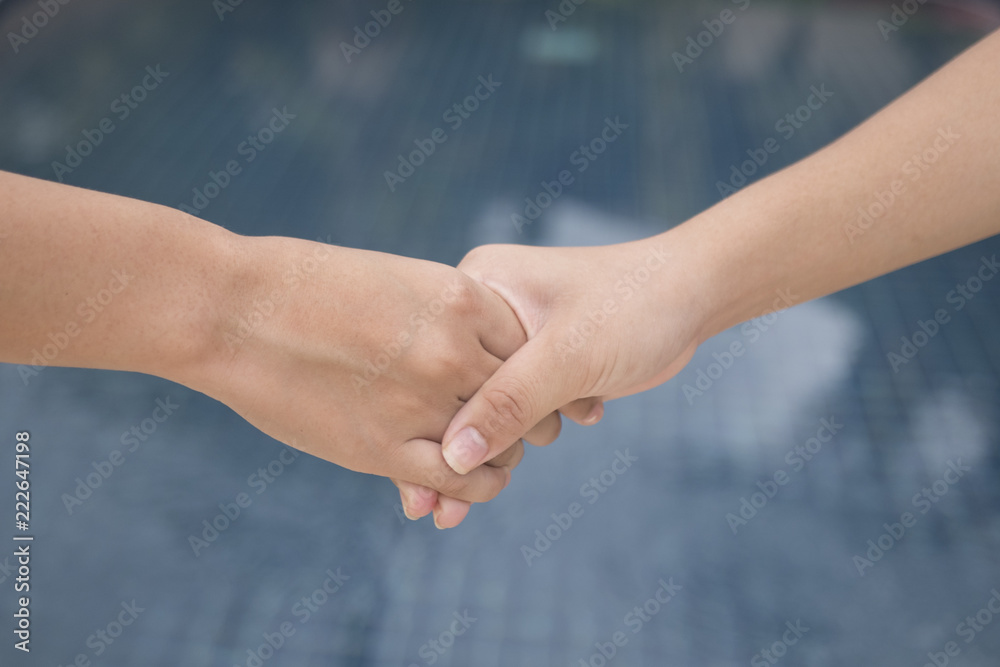 Asian girl handshake with pleasure. Asian girl handshake with pleasure.