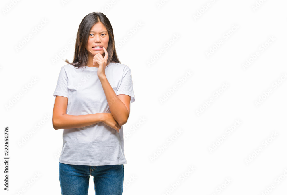Young asian woman over isolated background looking stressed and nervous with hands on mouth biting nails. Anxiety problem.