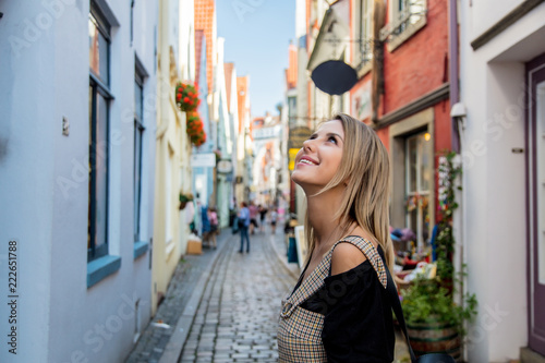 Young lady in dress on medieval street of Bremen, Germany. Trevel destination concept © Masson
