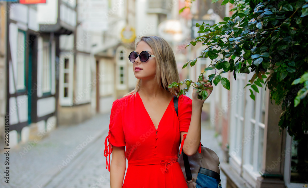 Young lady in dress on medieval street of Bremen, Germany. Trevel destination concept Young lady in dress on medieval street of Bremen, Germany. Trevel destination concept