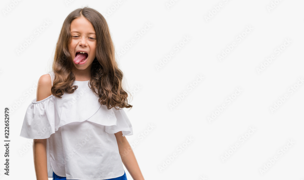 Brunette hispanic girl sticking tongue out happy with funny expression. Emotion concept. Brunette hispanic girl sticking tongue out happy with funny expression. Emotion concept.