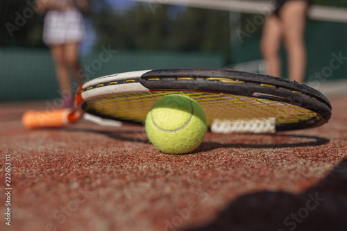 Tennis ball and racket on the dross cort. Tennis. Lifestyle or Hobby, Sport or Entertaiment, Pain or Health, Joy or Job © alfa27