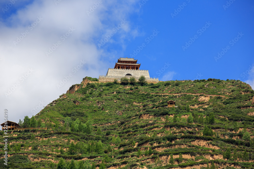 Chinese Temple at the top of a hill, entrance to Songpan, Sichuan Province China. Minshan Mountain Range. High Altitude Mountain Road, Cloudy Summit, Rocks, Chinese Architecture, Tibetan Plateau