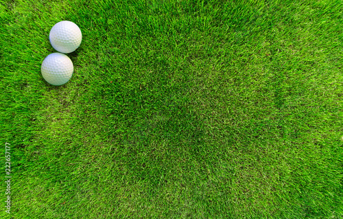Two Golf Balls Lying on Green Grass View from Above