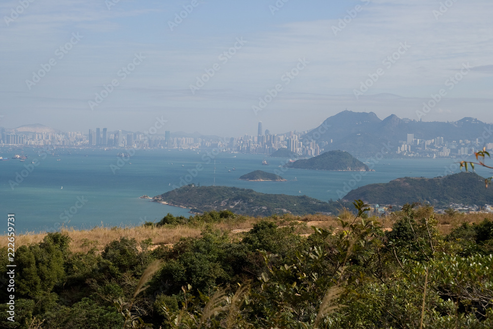Hong Kong Skyline with small Island and Fisher Village in Foreground