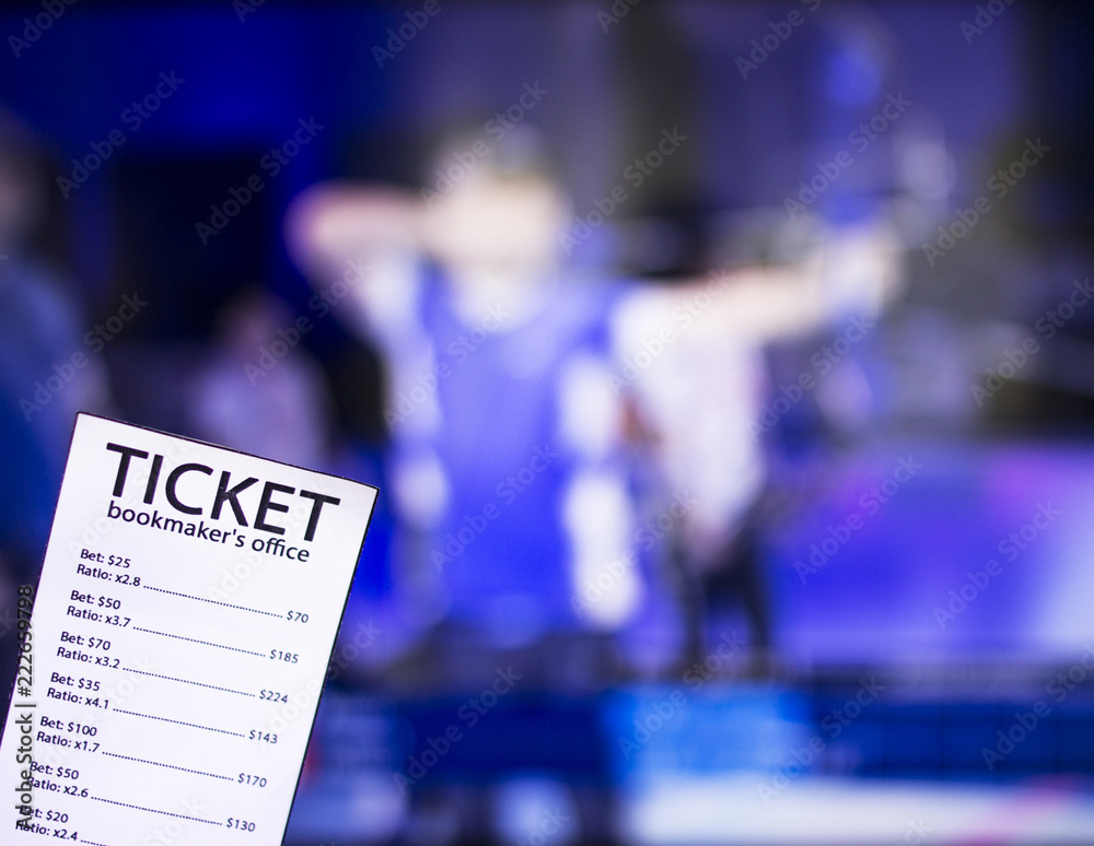 Fototapeta premium Bookmaker ticket on the background of TV on which show sports archery, sports betting, bookmaker, archery