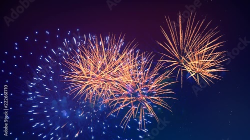 Colourful fireworks are glowing in the night sky. Happy new year concept.