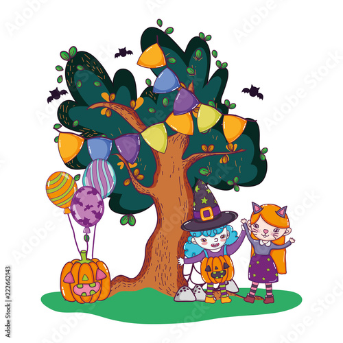 grils with costumes and pumpkin with balloons and tree