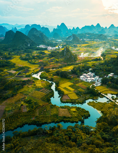 Photography Aerial photo of a sunset over rice fields
