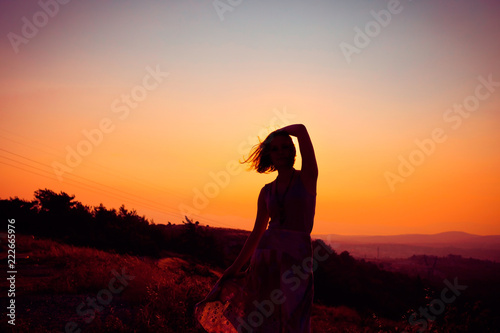 Silhouette of a girl at sunset