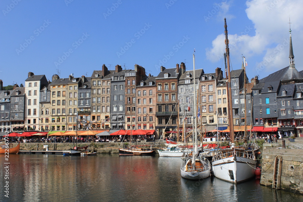 the famous fishing port in honfleur at a beautiful sunny summer day
