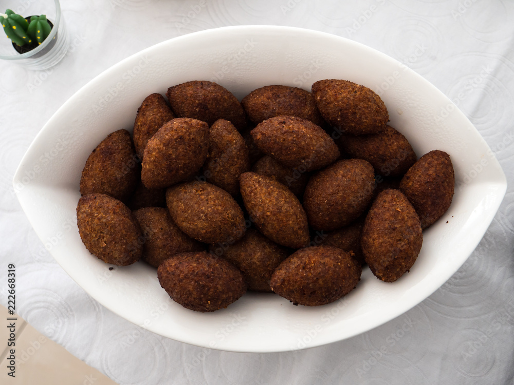 A plate with kibbe, a famous arabic food A plate with kibbe, a famous arabic food