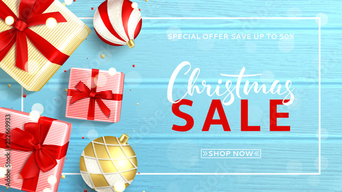 Elegant web banner for Christmas sale. Beautiful background with top view on realistic gift boxes and Christmas balls on rustic wooden texture. Vector illustration with confetti and effect bokeh.
