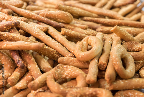 Fresh small sesame bread sticks sold at local city farmers market © vadiml