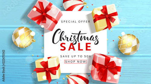 Beautiful web banner for Christmas sale. Elegant background with top view on realistic gift boxes and Christmas balls on rustic wooden texture. Vector illustration with confetti and effect bokeh.