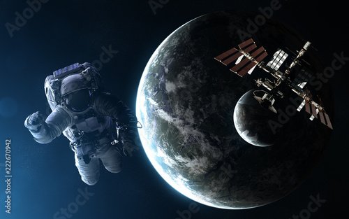 Fototapeta Naklejka Na Ścianę i Meble -  Astronaut, space station, exoplanet with moon in light of blue star. Abstract science fiction. Elements of the image are furnished by NASA