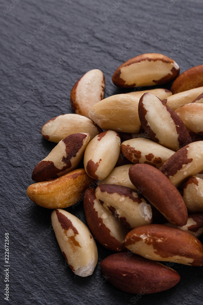 brazil nut on a dark stone background brazil nut on a dark stone background