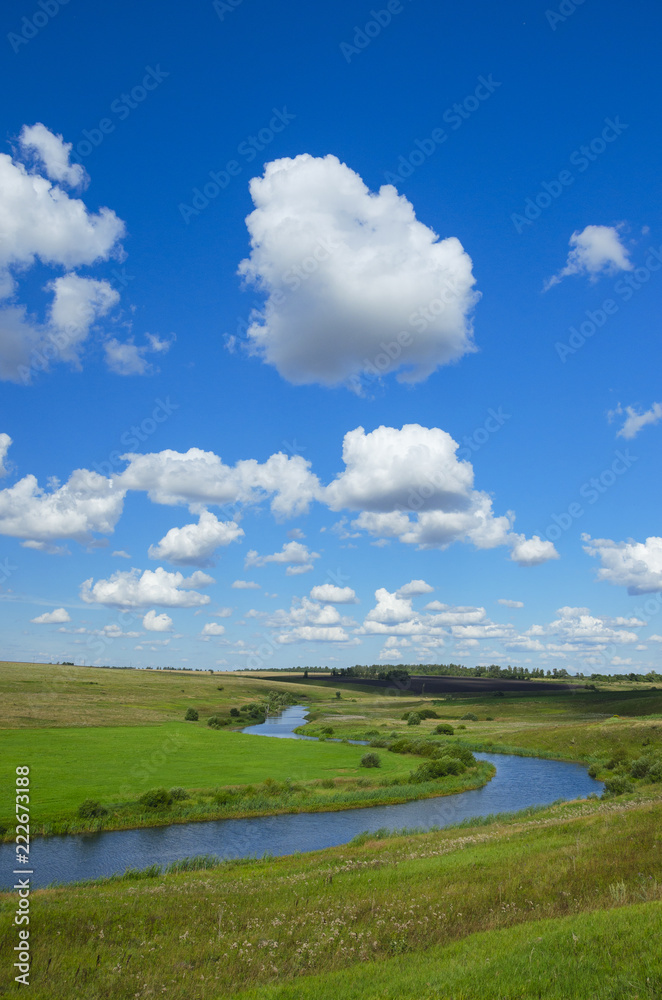 Sunny summer landscape with river curve.Beautiful view of fields,meadows,pastures and woods. Sunny summer landscape with river curve.Beautiful view of fields,meadows,pastures and woods.