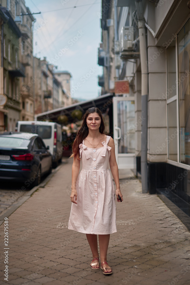 young woman walking on the street