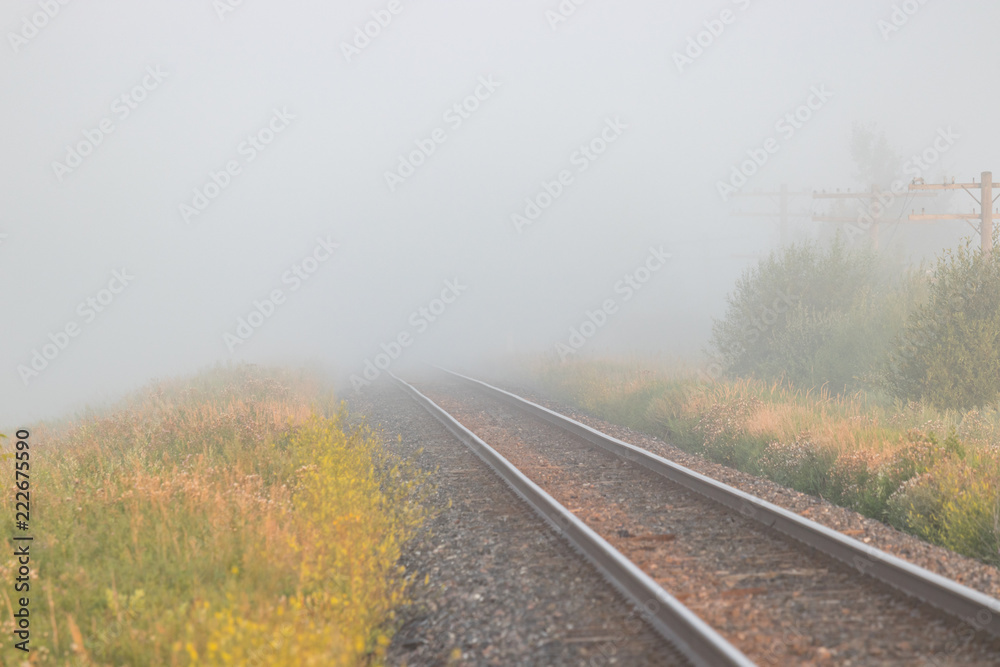 Pair of Train Tracks Leading Off Into Fog Pair of Train Tracks Leading Off Into Fog