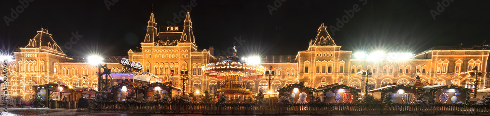 Panoramic view on GUM in festive Christmas and New Year time at winter, Red square, Moscow, Russia. Xmas celebration in Moscow with lights decoration of GUM.
