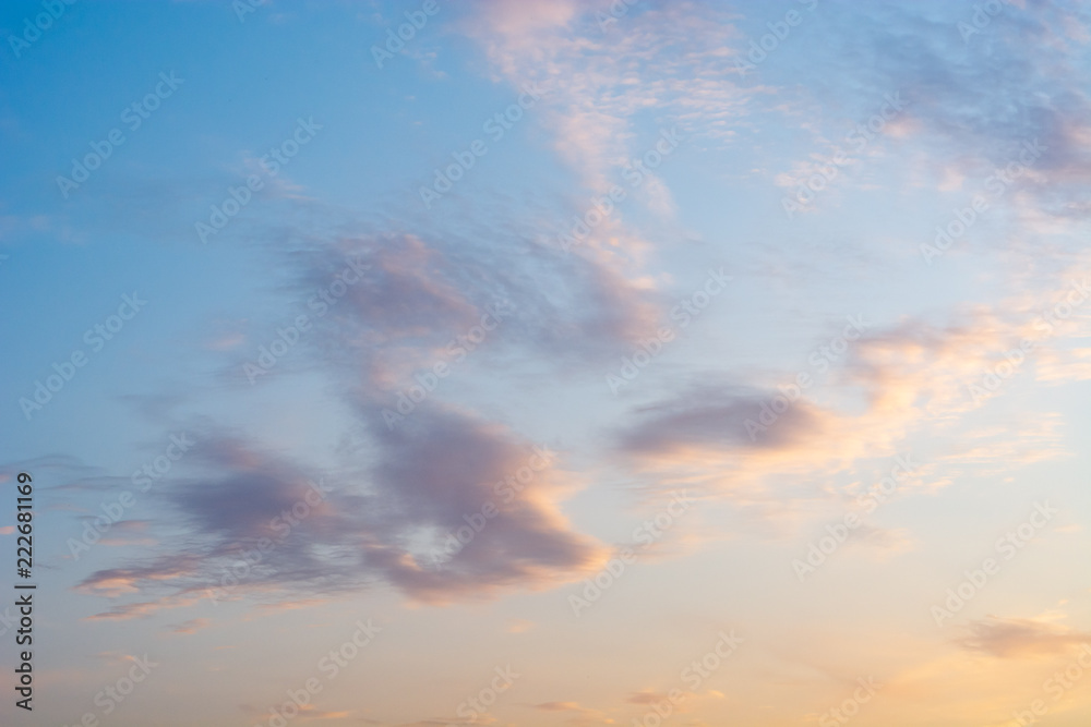 Magnificent cloudy summer sky with sunset or sunrise colours