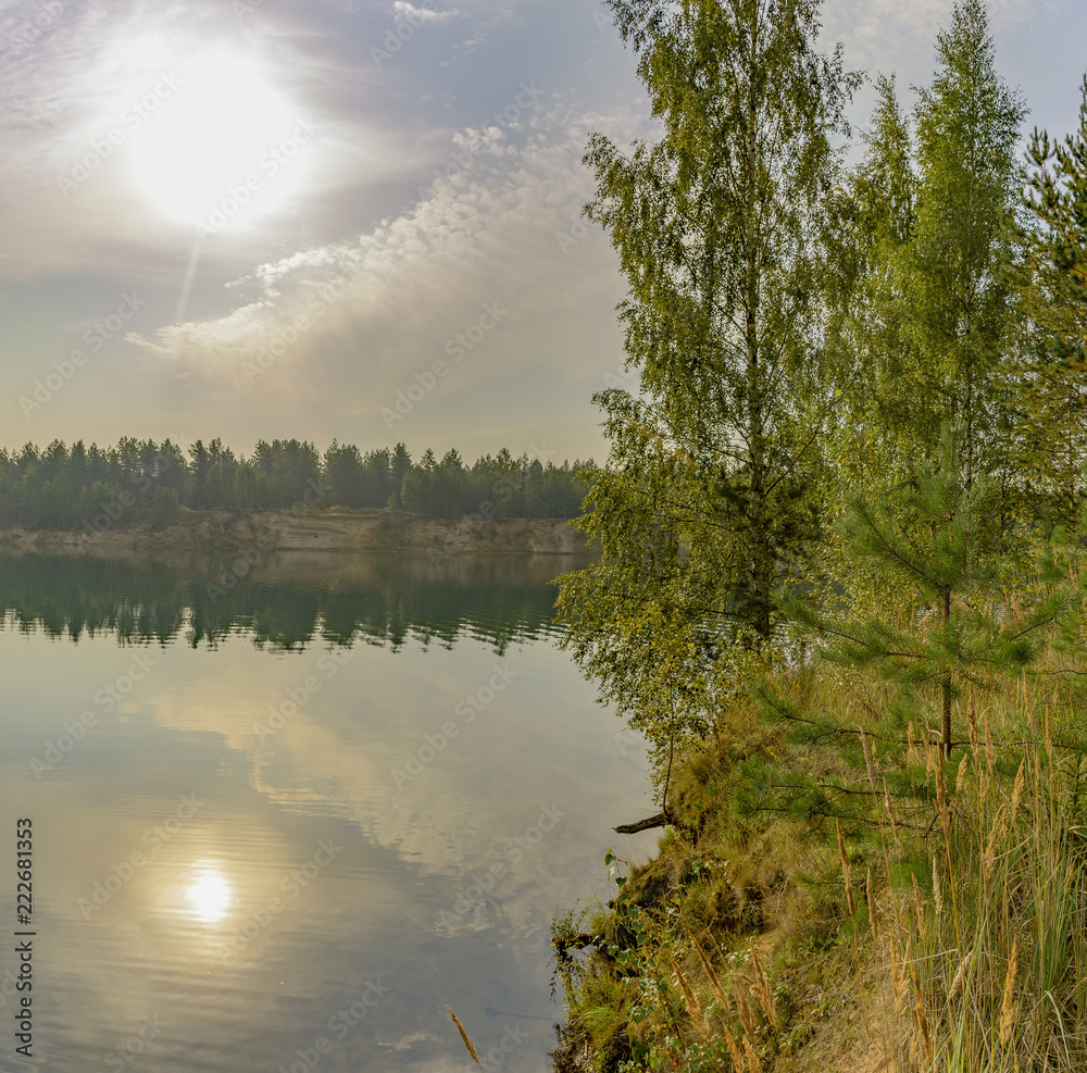 Fototapeta premium Artificial lake formed after the removal of sand. Closed sand quarry.