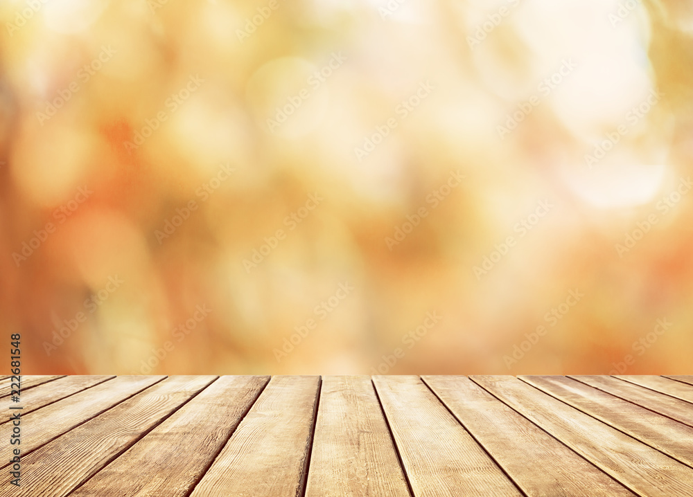 Wooden table top on blur abstract autumn background Wooden table top on blur abstract autumn background