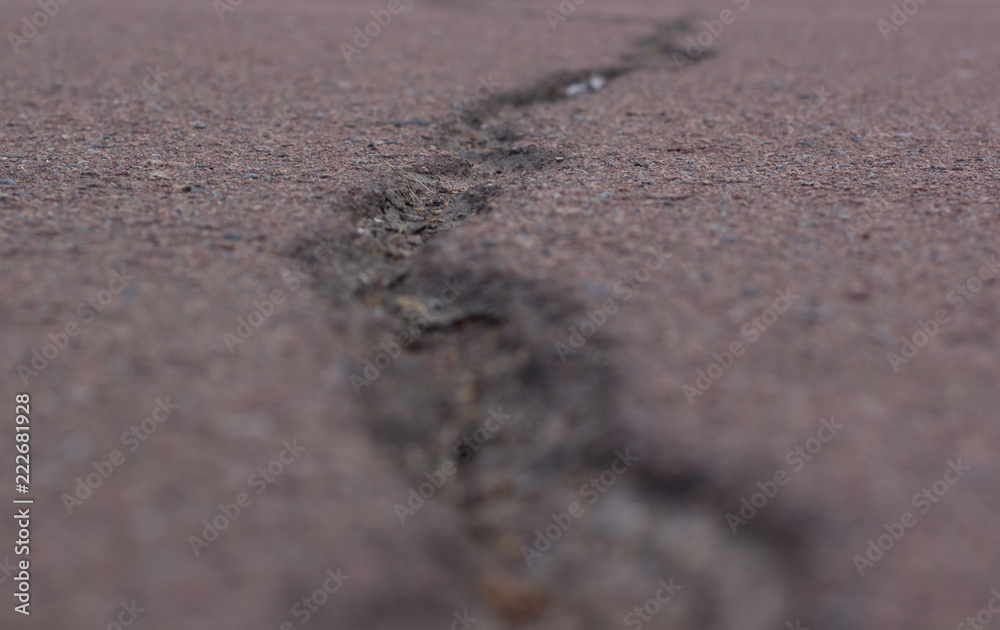 crack in the asphalt background texture concept on concrete road, copy space crack in the asphalt background texture concept on concrete road, copy space