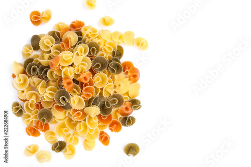 A stack of three colors pasta (in form of mushrooms) on white background (isolated). Top view.