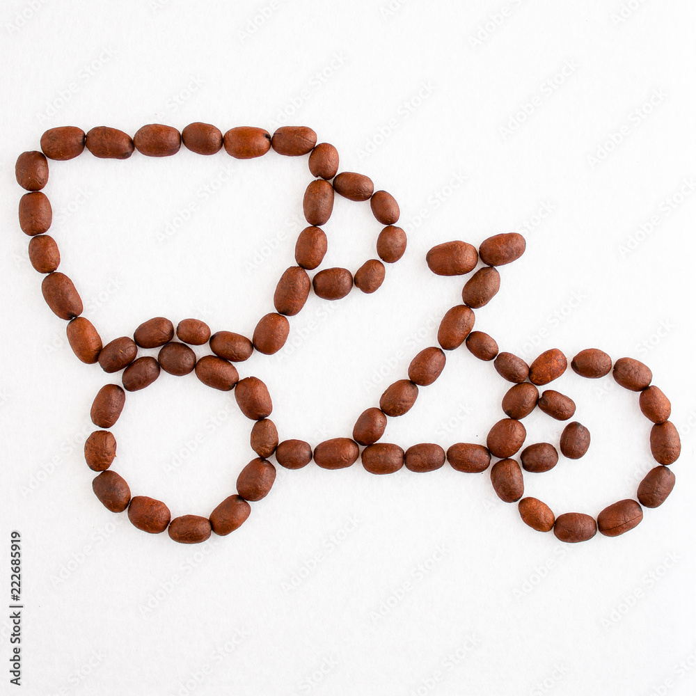 A figure of a bicycle with a cup instead of a wheel of coffee beans on a white background A figure of a bicycle with a cup instead of a wheel of coffee beans on a white background