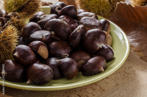 chestnut and autumn feeling, still life with chestnuts and autumn leaves.