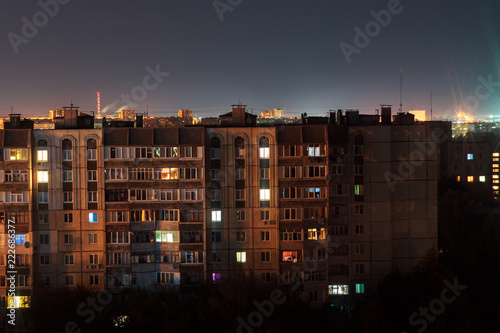 Night long exposure photo 9 and 10 floors high-rise buildings in orange colours. Big city life is here!