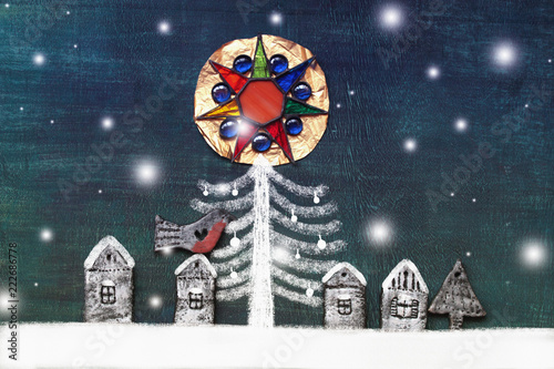 Christmas and New Year card with glass star and figures of houses and bullfinch