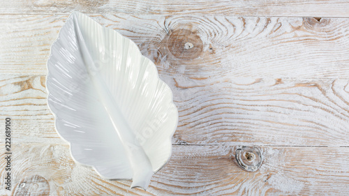 Perspective view. Empty white plate on wooden texture background. top view, space for text
