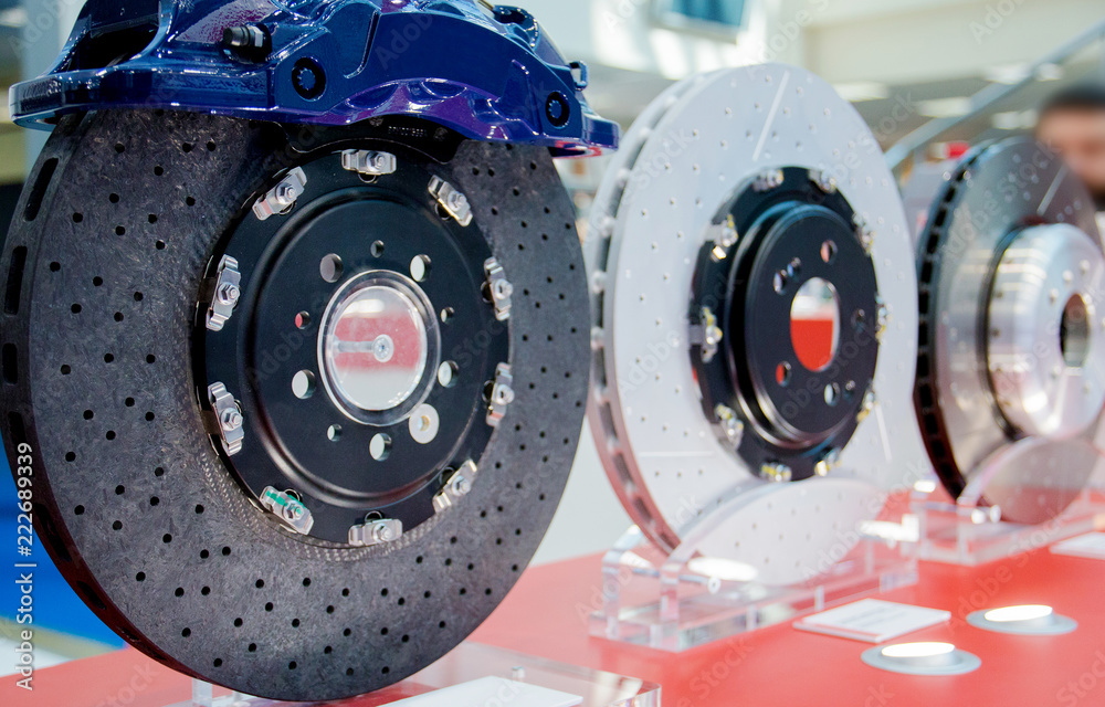 brake disc and blue calliper from a racing car brake disc and blue calliper from a racing car